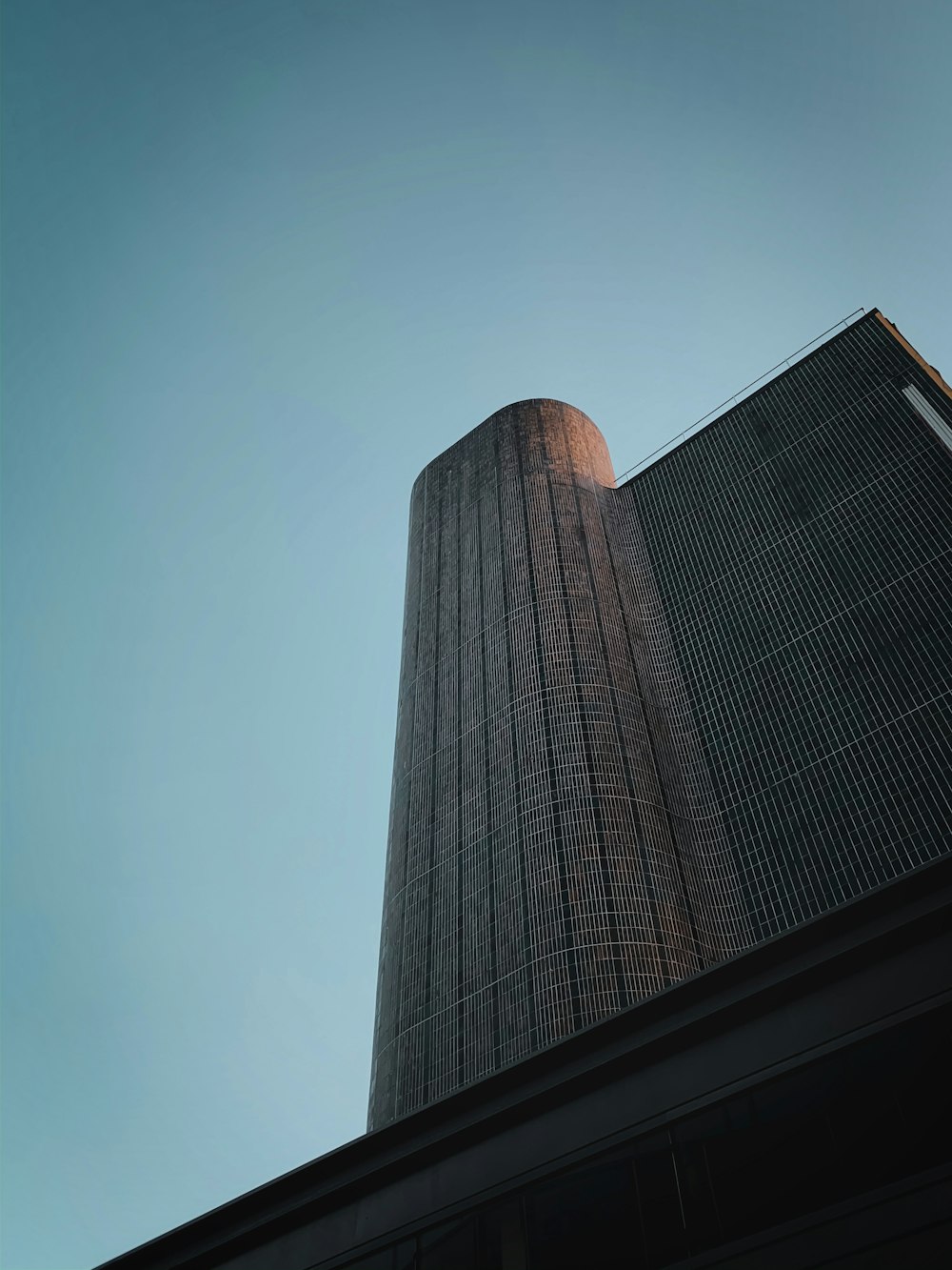 a tall building with a blue sky in the background