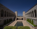 A serene courtyard with symmetrical stone pathways converging at a central point.