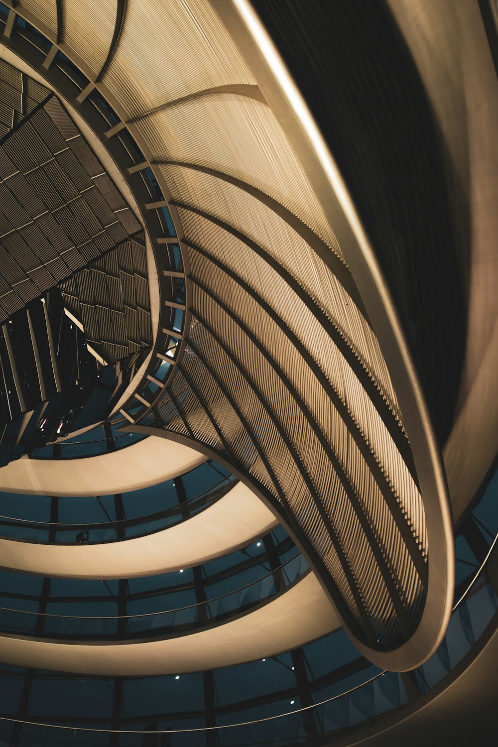 a spiral staircase inside of a building with a skylight