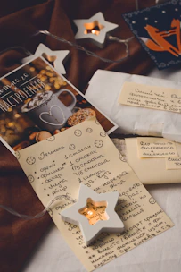 A cozy scene of a handwritten letter on textured paper beside a warm cup of tea.
