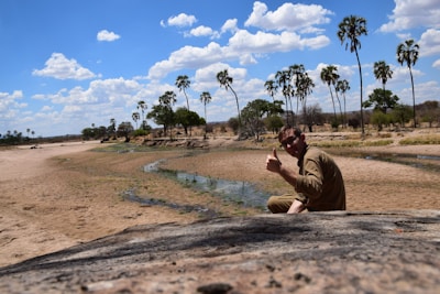 Happy user giving a thumbs up while using the bapsyprep app outdoors.