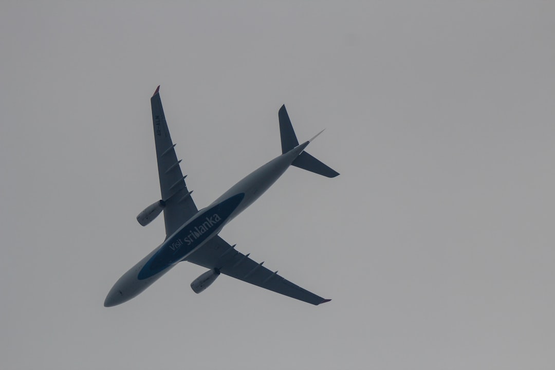 white flying airline, A plane over Chennai with the slogan