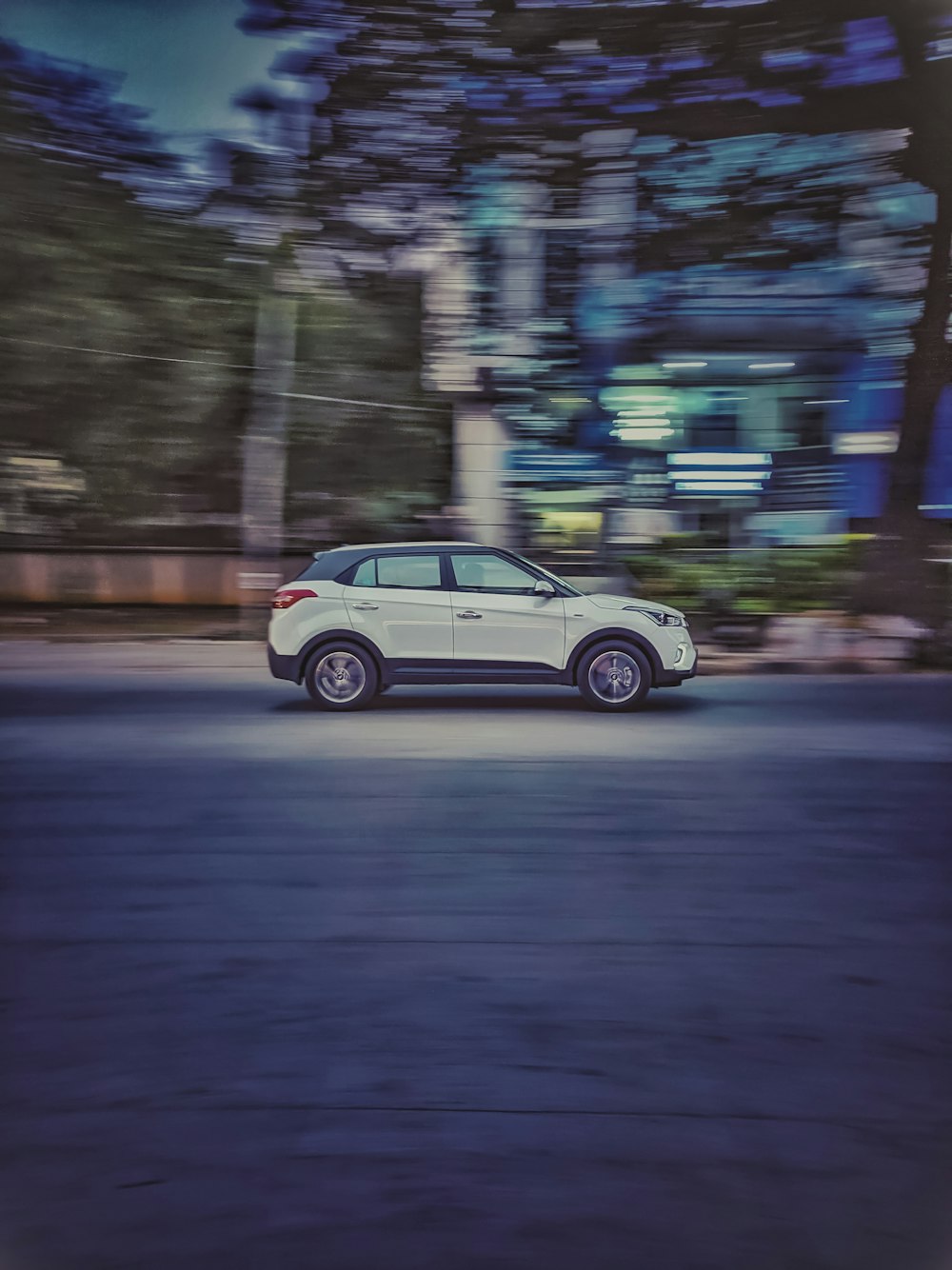 panning photography of SUV