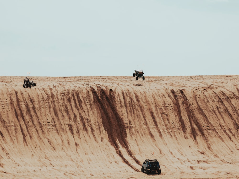 black vehicle on the desert