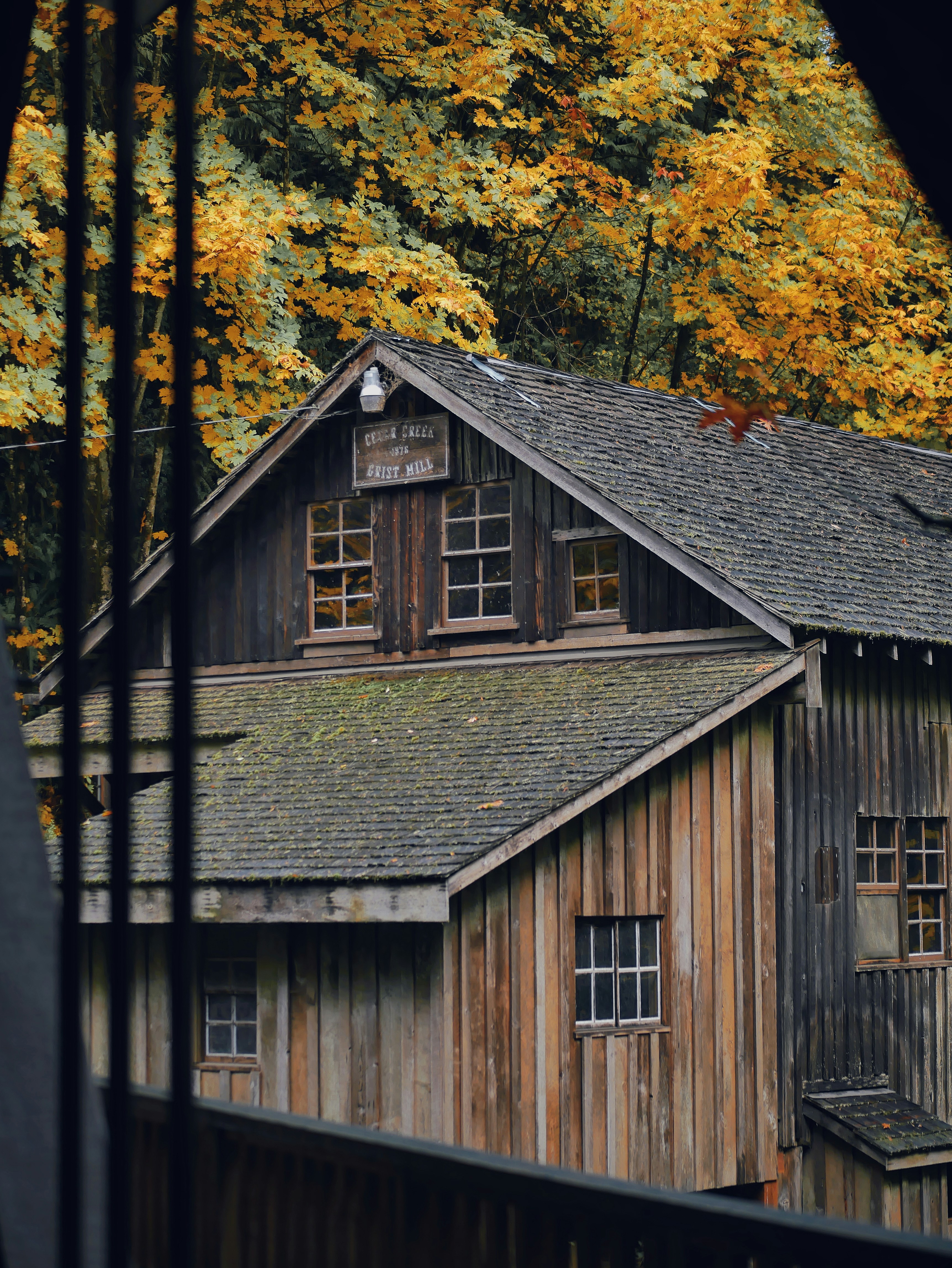 Brown Wooden House Beside Green Trees Photo Free Outdoors Image