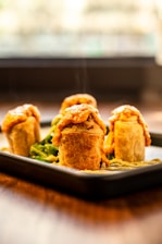 steaming foods on black tray