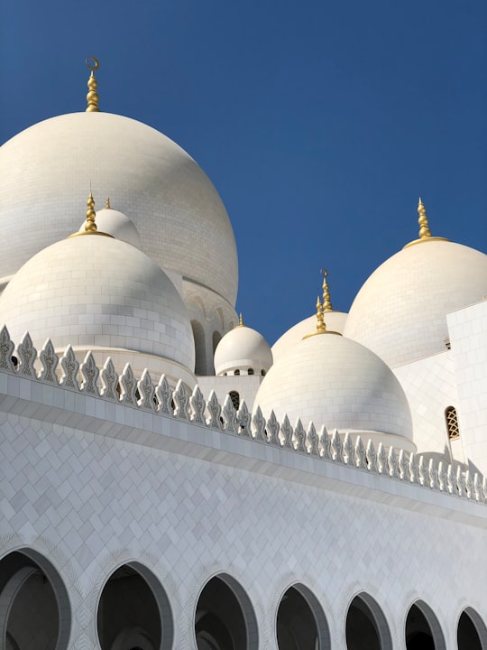 white dome building view in Sheikh Zayed Grand Mosque Center United Arab Emirates