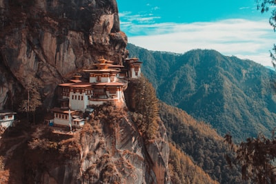 Paro Taktsang temple in Bhutan viewing mountain under blue and white sky