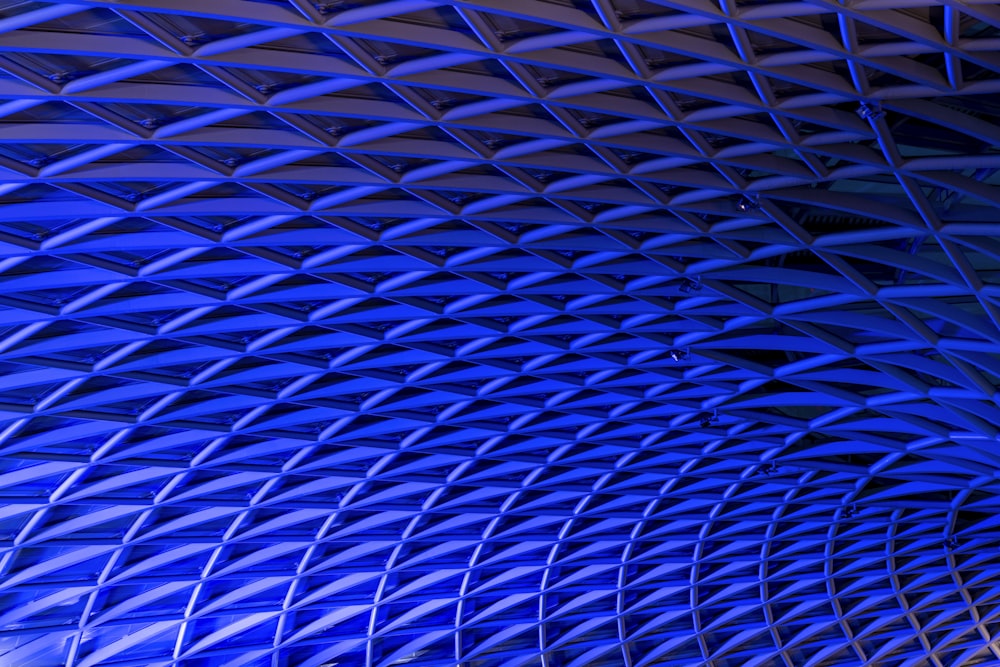 a blue ceiling with a clock on it