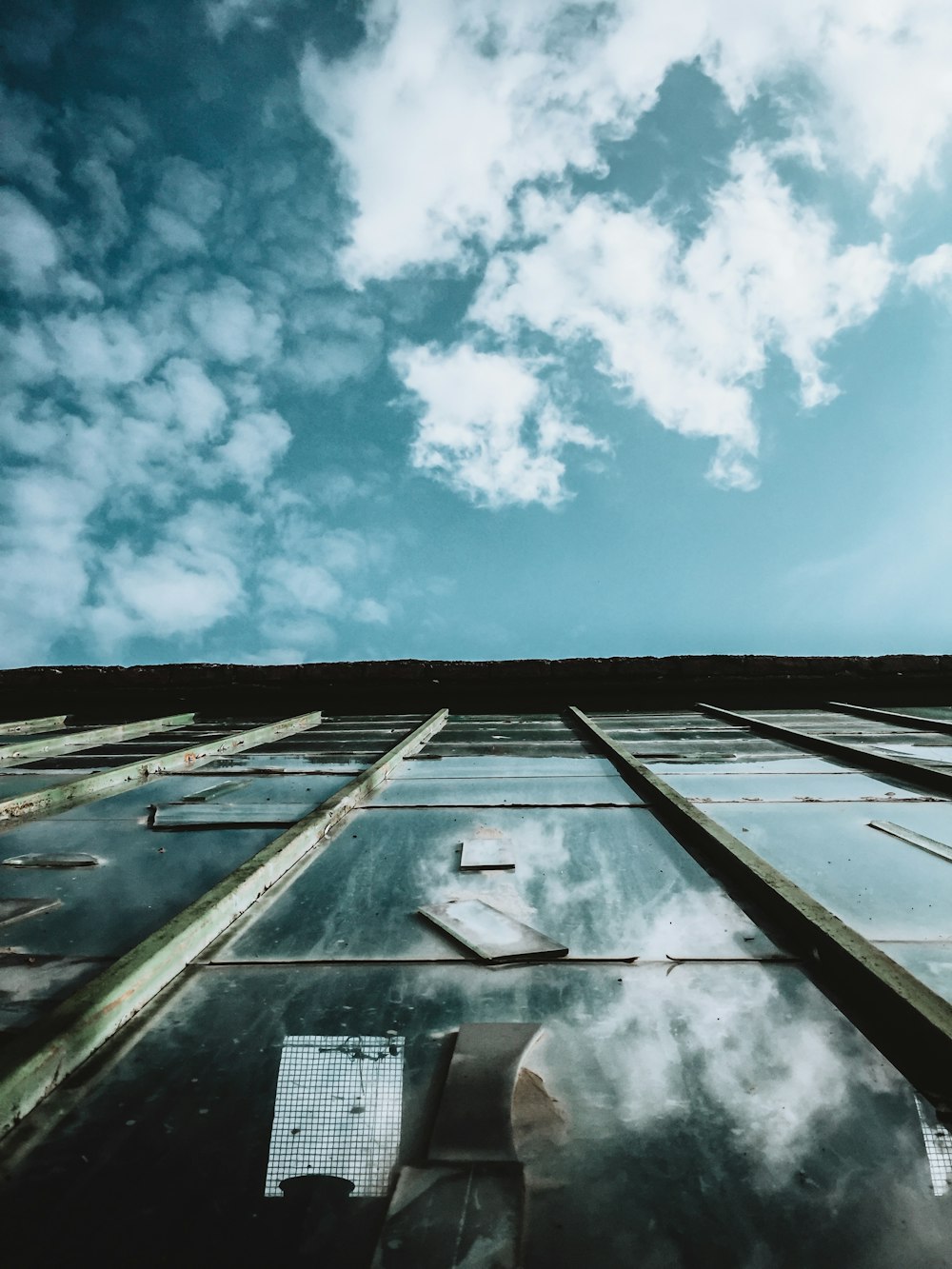 the sky is reflected in the windows of a building