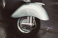 A detailed shot of the scooter’s motor and wheel, highlighting quality craftsmanship.