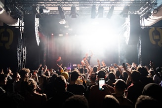 man singing on the stage photograph