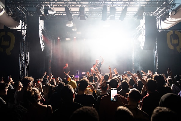 man singing on the stage photograph