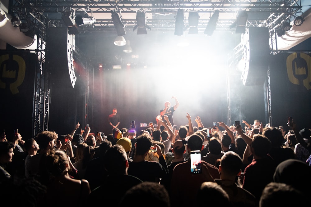 man singing on the stage photograph