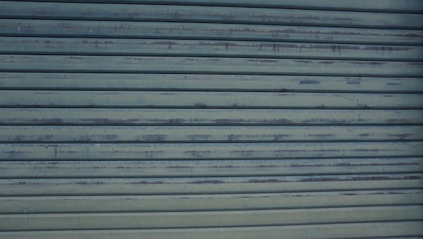 A close-up of a garage door repair in progress.