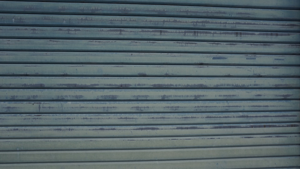 Close-up of a sturdy garage door spring being expertly repaired by a technician.