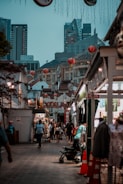 A bustling street market blending traditional culture with modern gadgets.