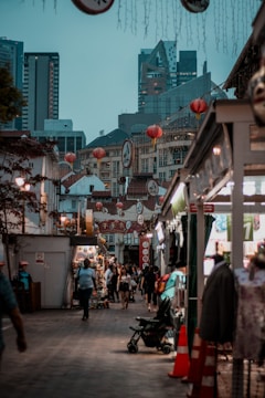 A bustling street market blending traditional culture with modern gadgets.
