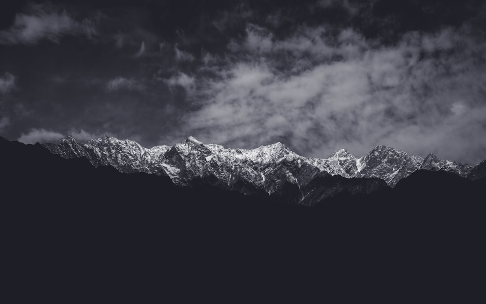 a black and white photo of a mountain range