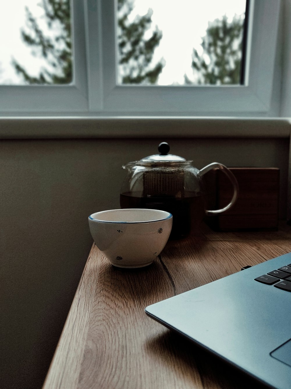 clear-glass coffee pitcher beside white ceramic mug