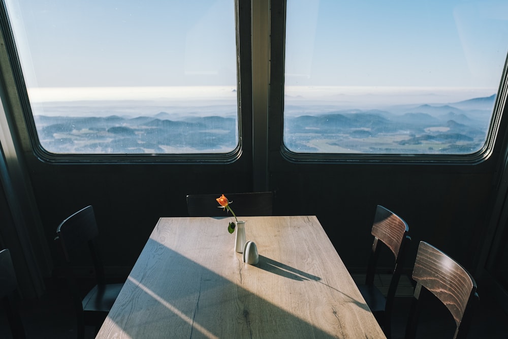 dining set beside windows