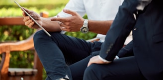 two people sitting during day