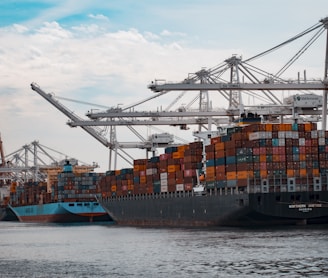 cargo ships docked at the pier during day