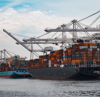 cargo ships docked at the pier during day