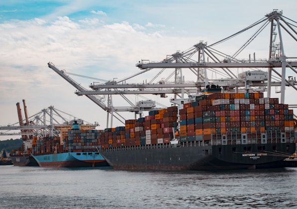 cargo ships docked at the pier during day