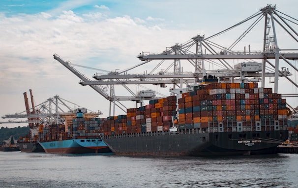 cargo ships docked at the pier during day