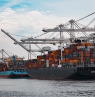 cargo ships docked at the pier during day