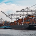 cargo ships docked at the pier during day