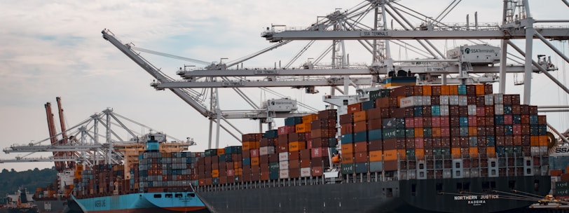 cargo ships docked at the pier during day