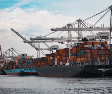 cargo ships docked at the pier during day