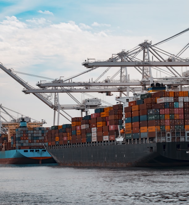 cargo ships docked at the pier during day