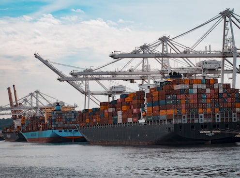 cargo ships docked at the pier during day