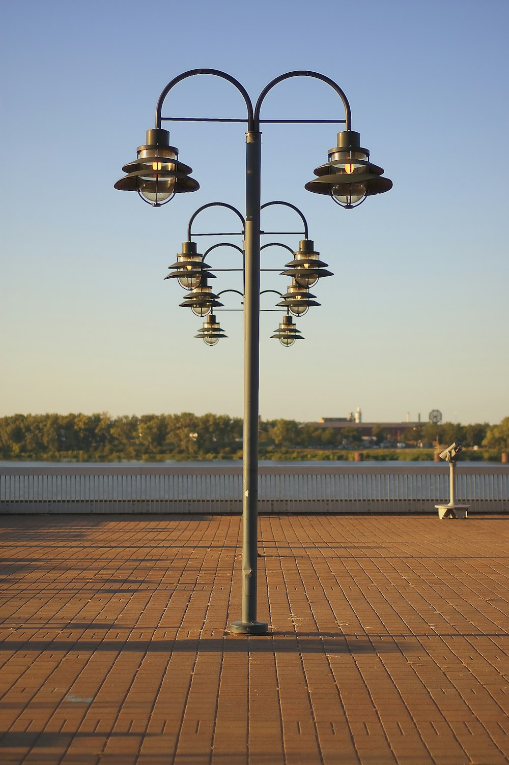 a lamp post with three lights on top of it