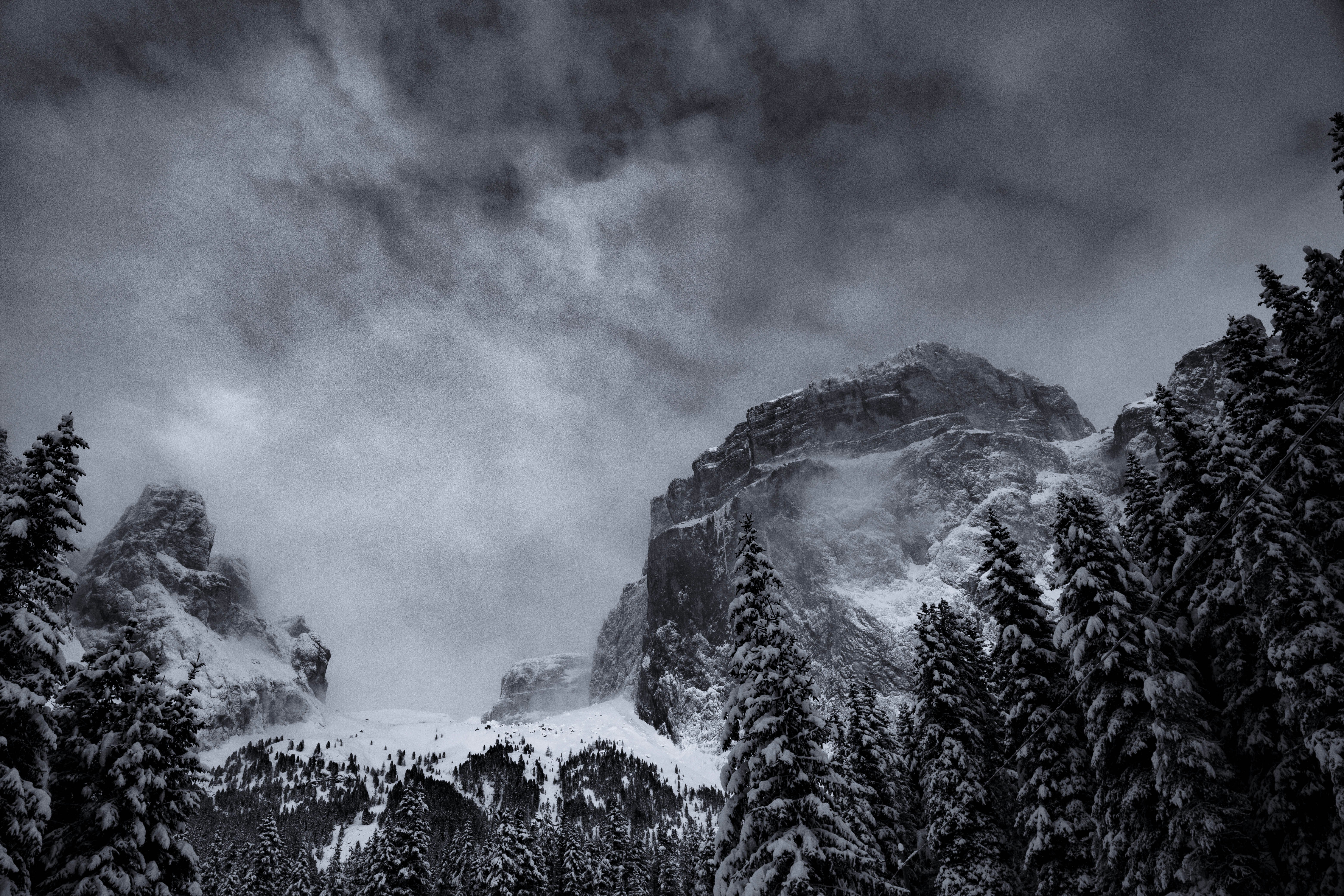 grayscale photography of summit view of mountain covered with snow