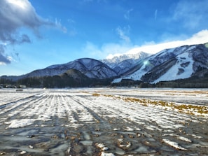 Snow-covered fields near Fürstenfeldbruck under a clear blue sky.