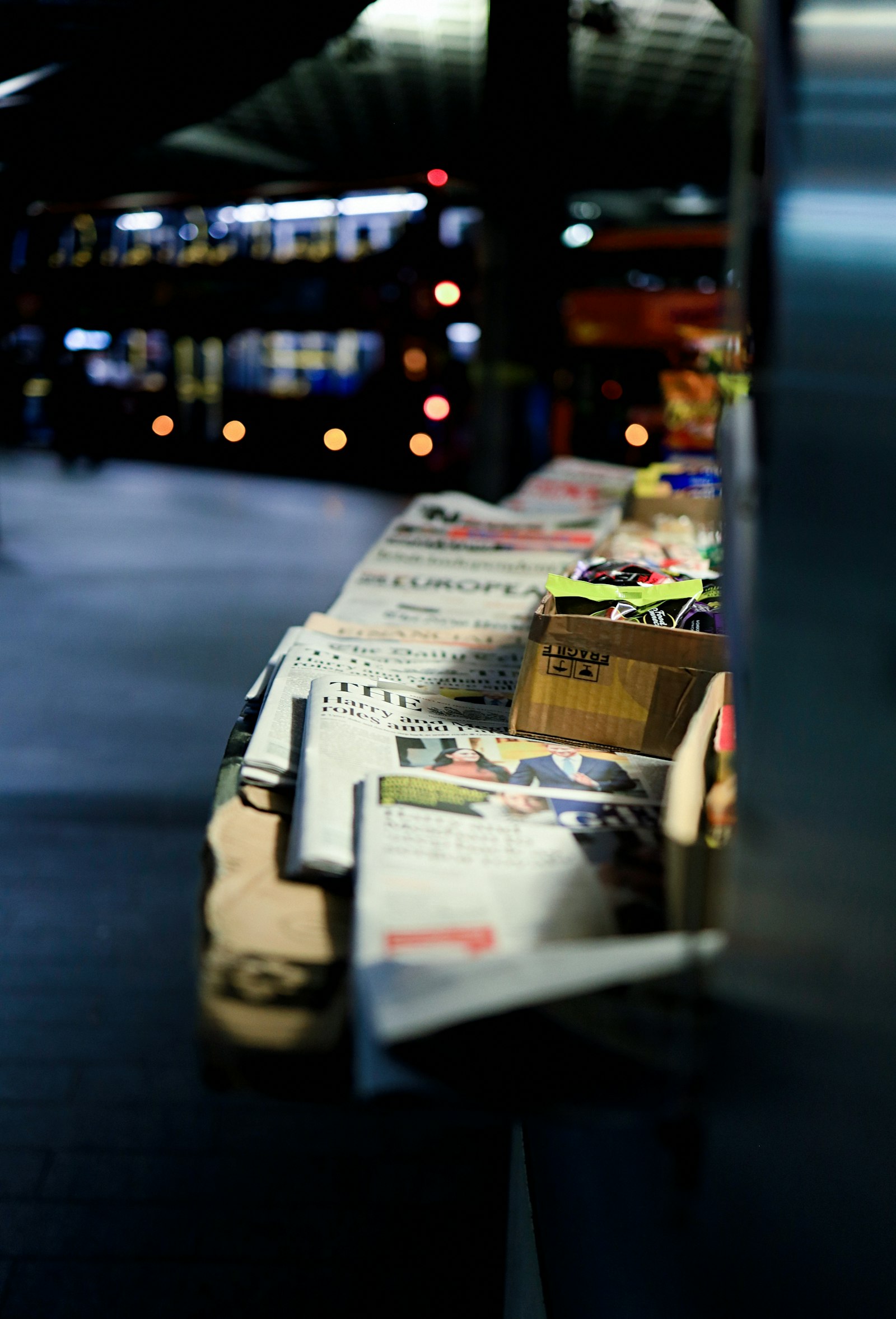 Canon RF 35mm F1.8 IS STM Macro sample photo. Newspaper on stall photography