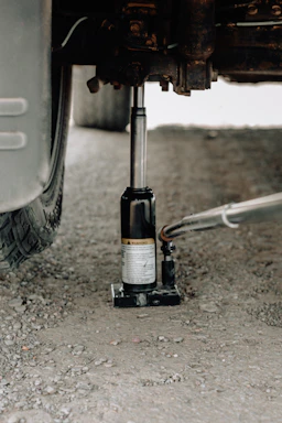 A close-up of a sturdy hydraulic car ramp lifting a vehicle smoothly.