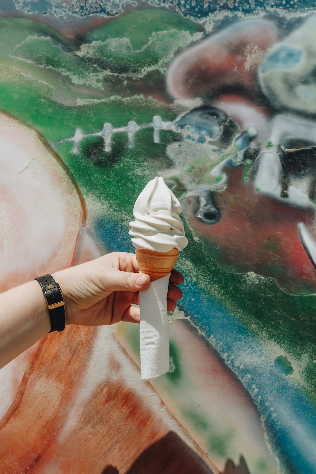 person holding ice cream cone