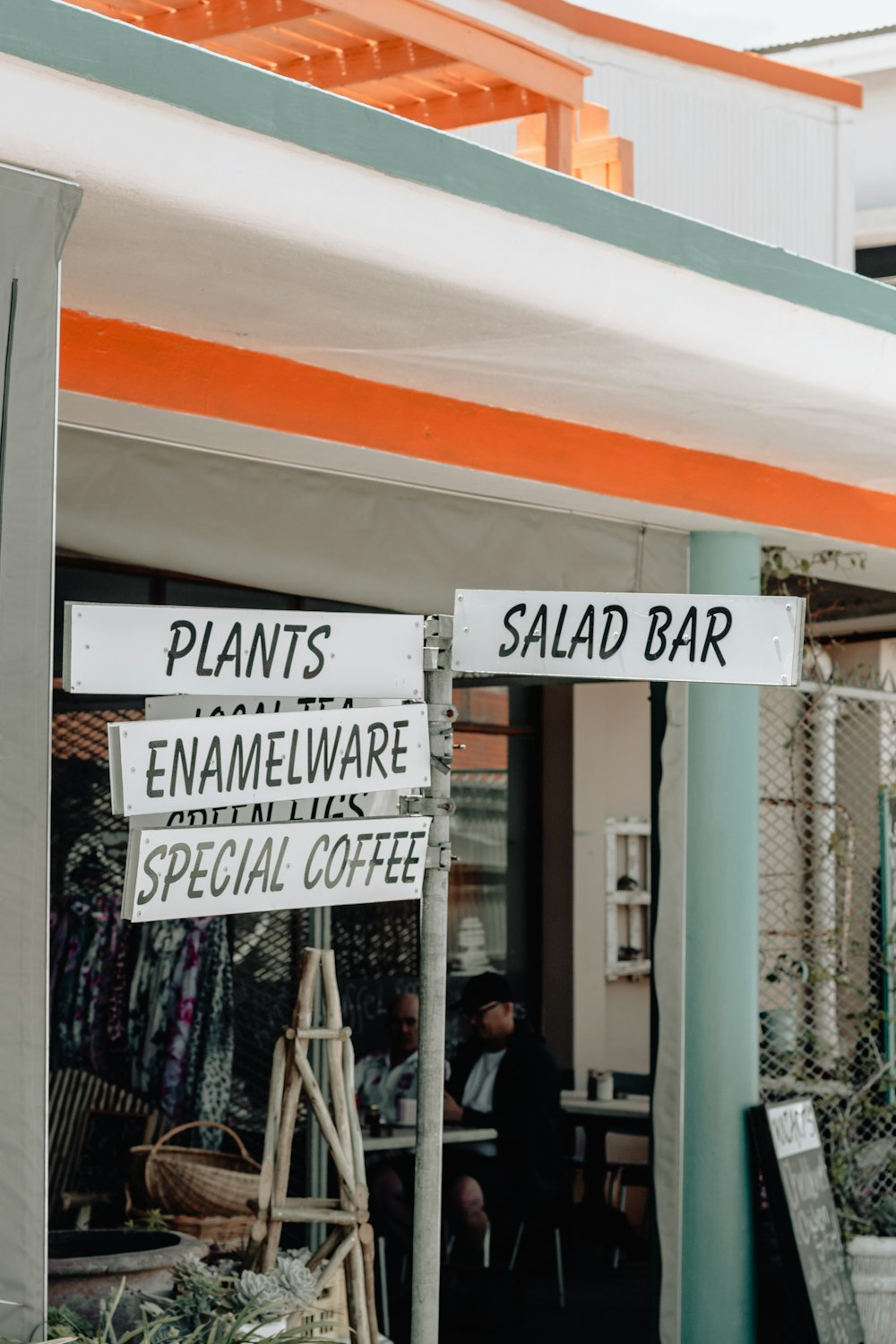 plants, enamelware, special coffee, and salad bar signage