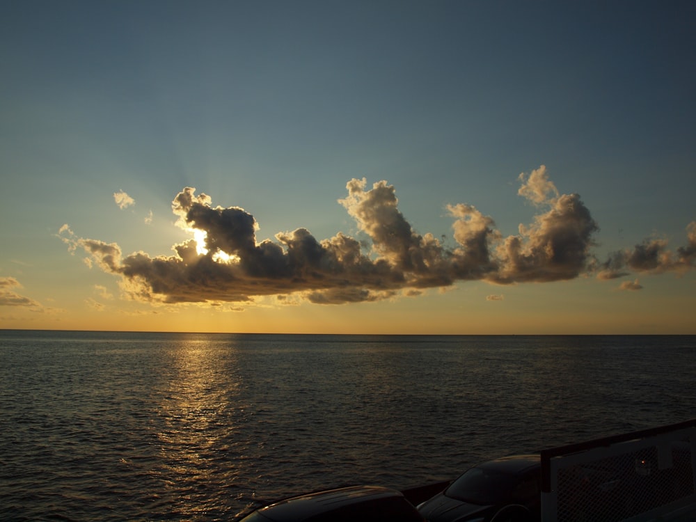 body of water under blue and gray sky