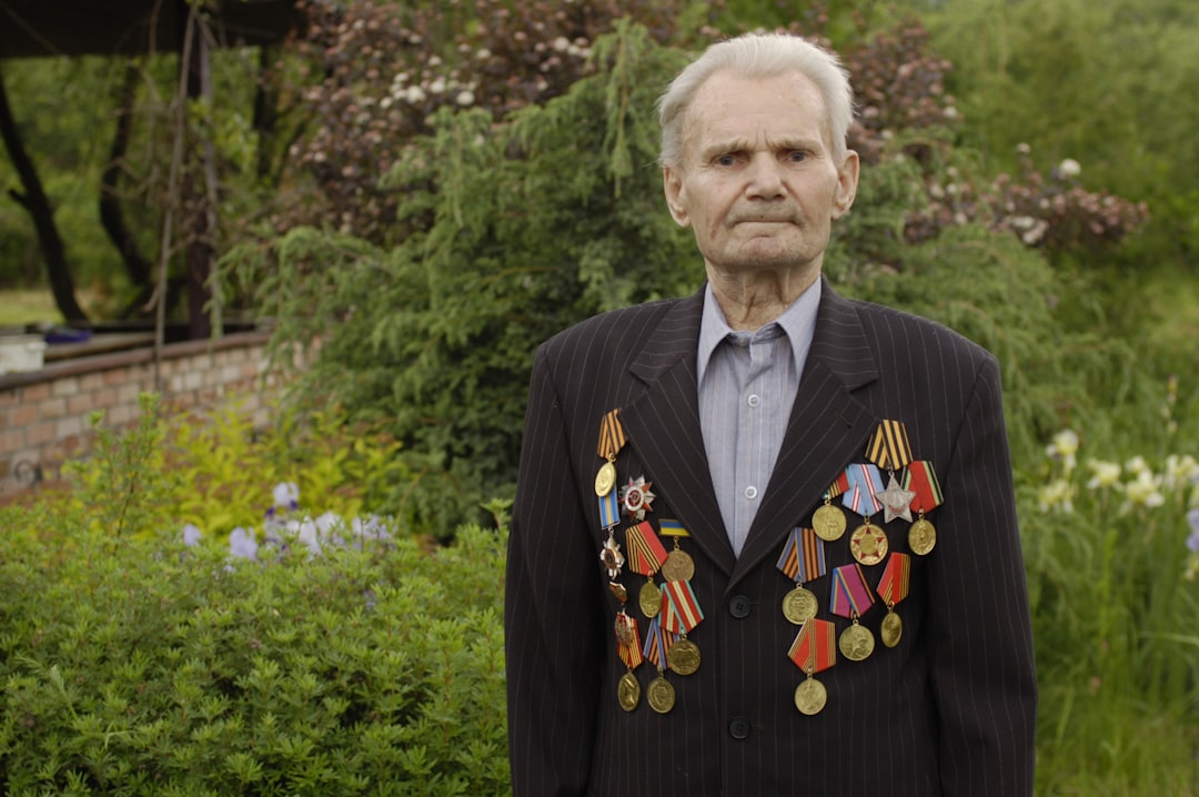 man in black blazer with medals