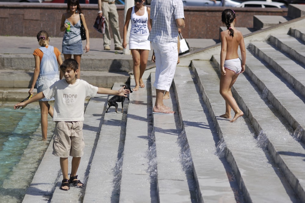 group of people standing on staircase