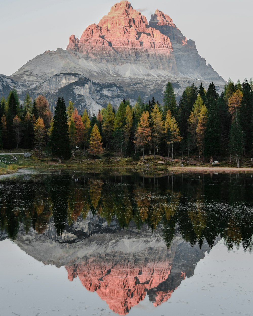 water reflect photography of mountain ridge