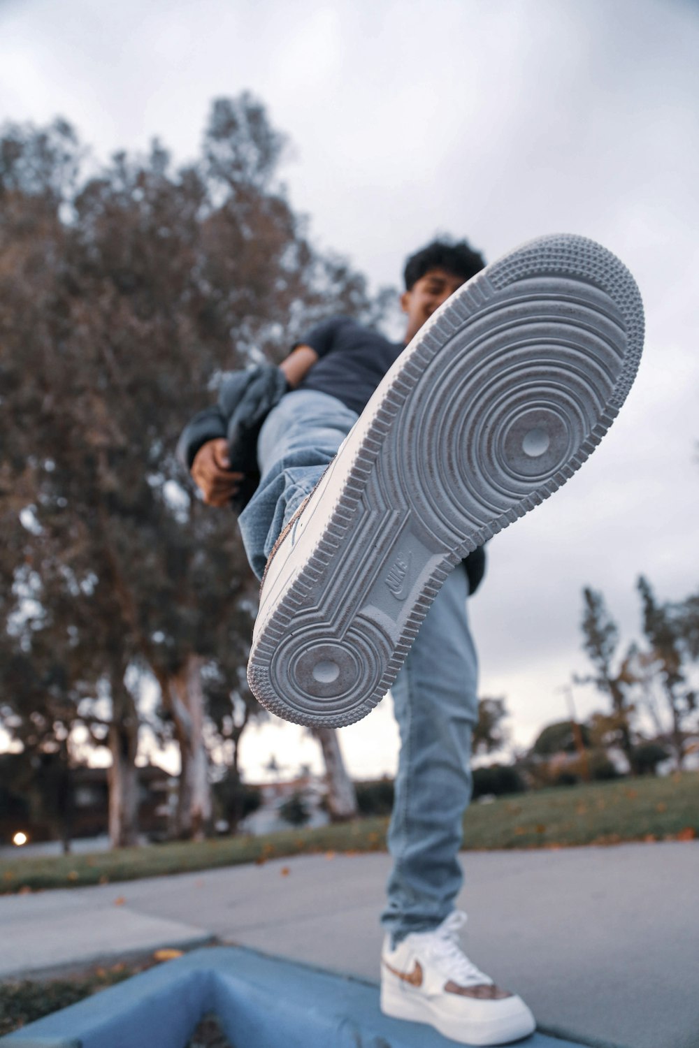 man showing his sneaker