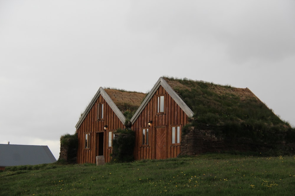 two cabins on grass field