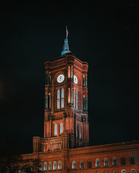 brown concrete clock tower in Rotes Rathaus Germany